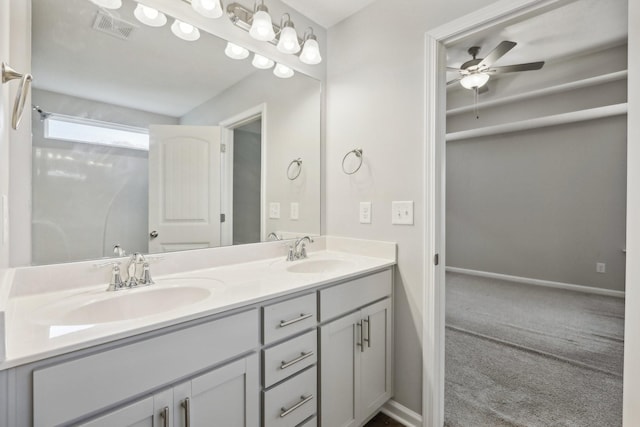 bathroom with ceiling fan and vanity