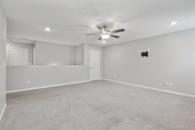 empty room featuring carpet and ceiling fan