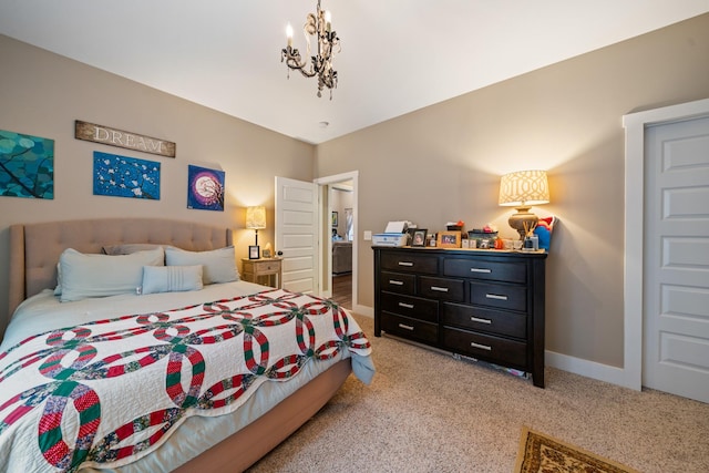 bedroom with carpet floors and an inviting chandelier