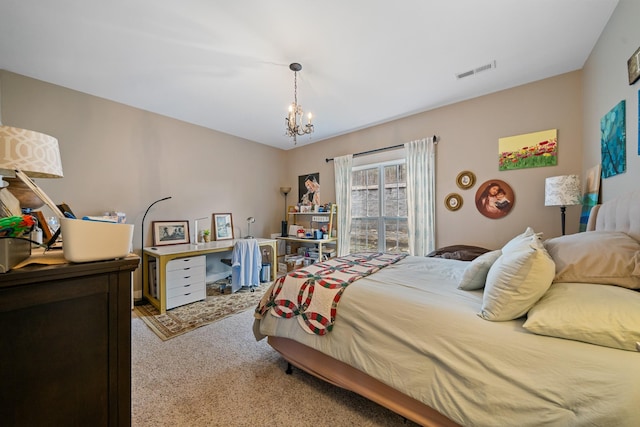 bedroom featuring a chandelier and light colored carpet