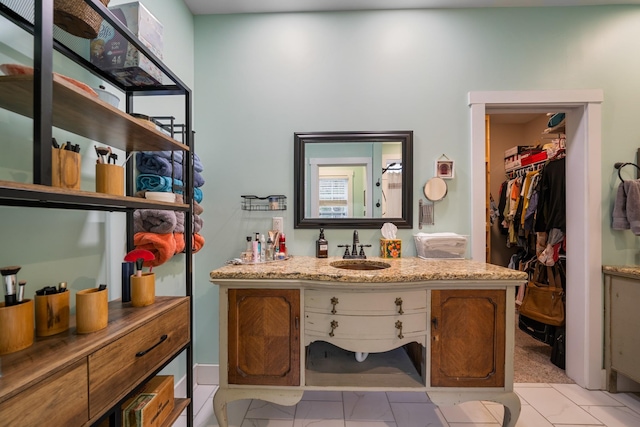 bathroom with tile patterned flooring and vanity