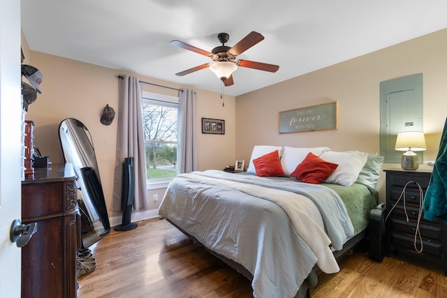 bedroom with light wood-type flooring and ceiling fan