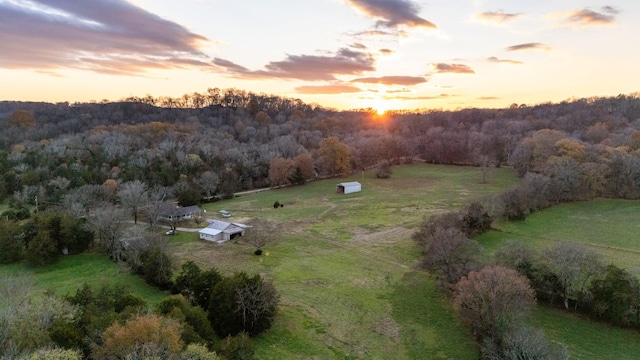 aerial view at dusk featuring a rural view