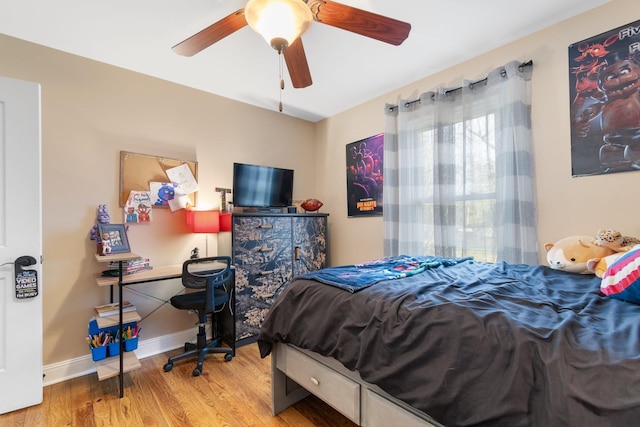 bedroom with hardwood / wood-style flooring and ceiling fan