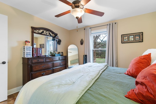 bedroom featuring wood-type flooring and ceiling fan