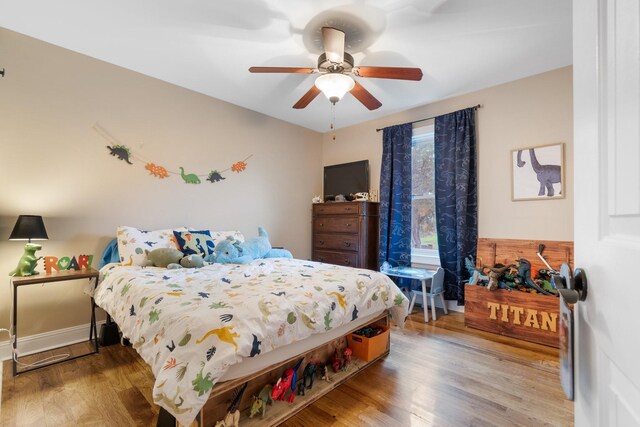 bedroom featuring ceiling fan and hardwood / wood-style flooring