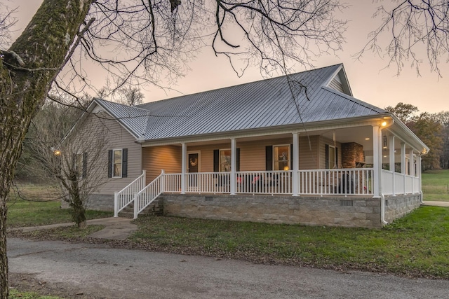 farmhouse-style home with covered porch