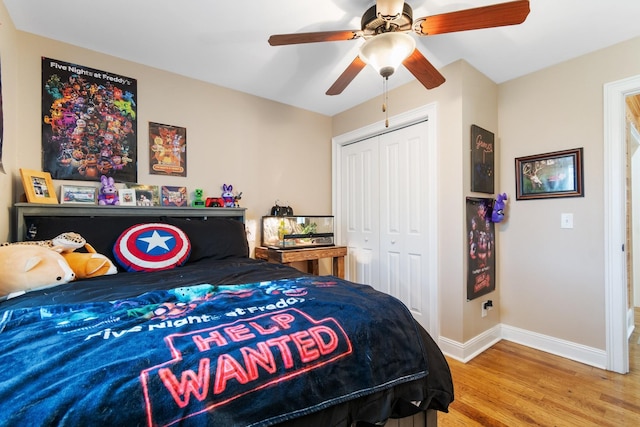 bedroom with hardwood / wood-style floors, ceiling fan, and a closet