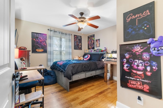 bedroom with ceiling fan and wood-type flooring