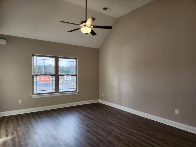 unfurnished room featuring ceiling fan, dark wood-type flooring, and lofted ceiling