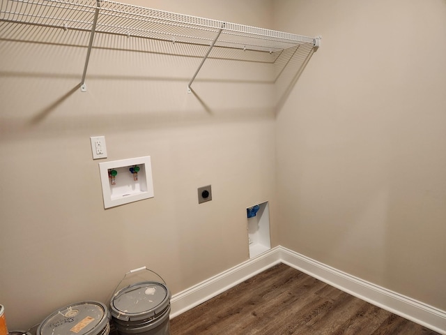 washroom featuring washer hookup, dark wood-type flooring, and hookup for an electric dryer