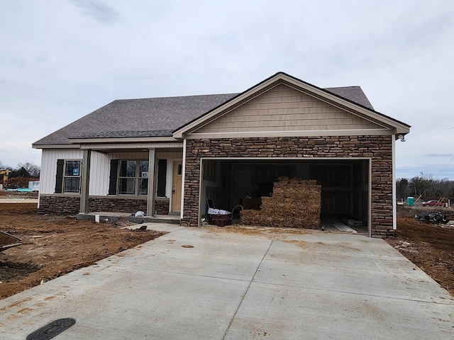 view of front of house with a porch and a garage