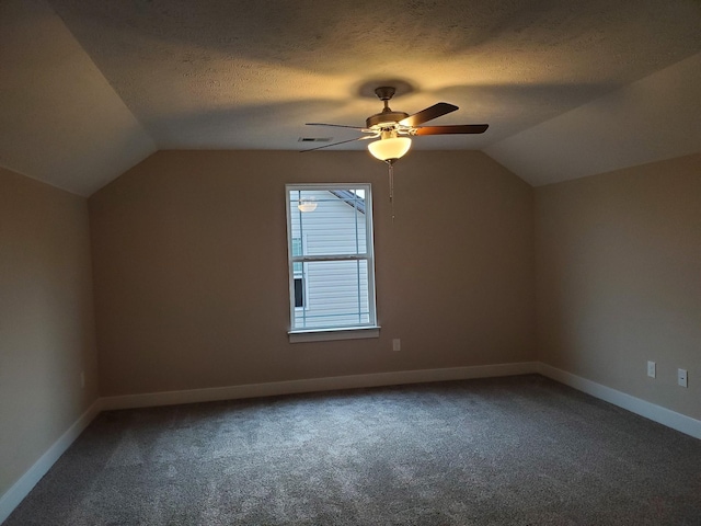 bonus room with carpet, a textured ceiling, and vaulted ceiling