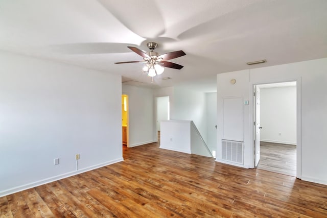 spare room featuring ceiling fan and wood-type flooring