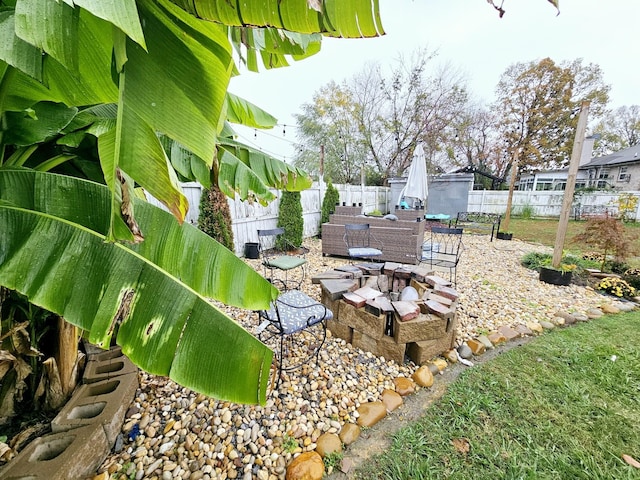 view of yard with a patio area and an outdoor fire pit