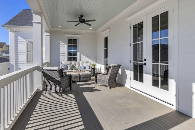 wooden deck featuring outdoor lounge area, ceiling fan, and french doors