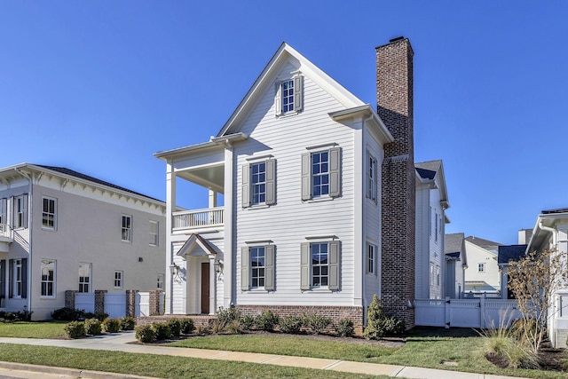 view of front of house with a balcony