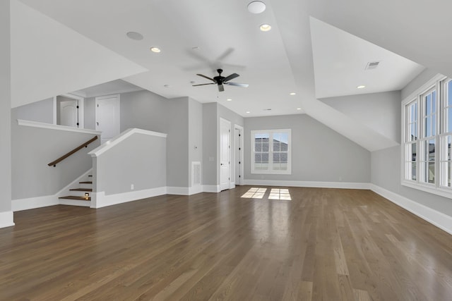 unfurnished living room with ceiling fan, dark wood-type flooring, and lofted ceiling