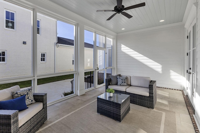 sunroom / solarium featuring ceiling fan and wood ceiling