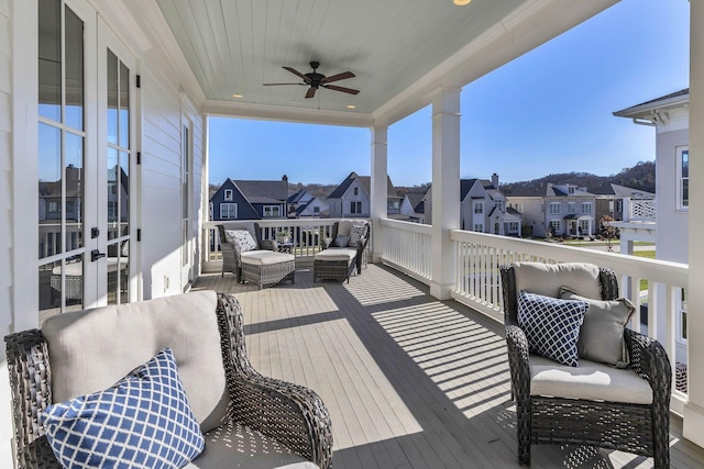 wooden terrace featuring ceiling fan