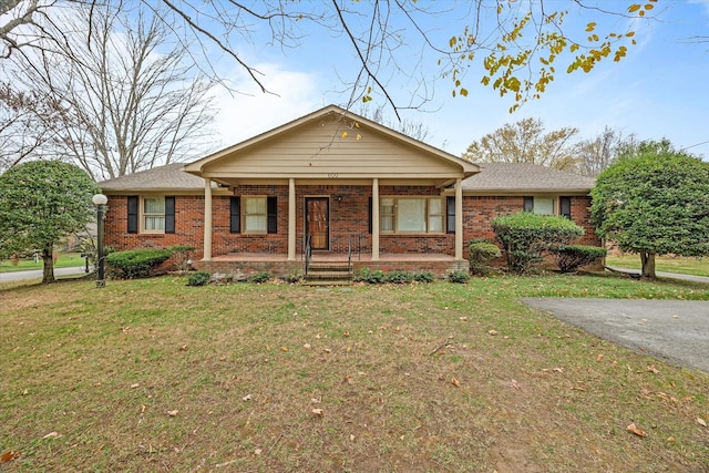 single story home with a porch and a front yard