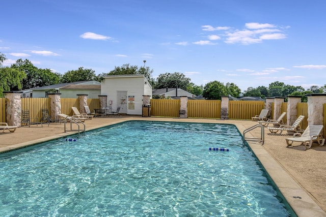 view of swimming pool with a patio area