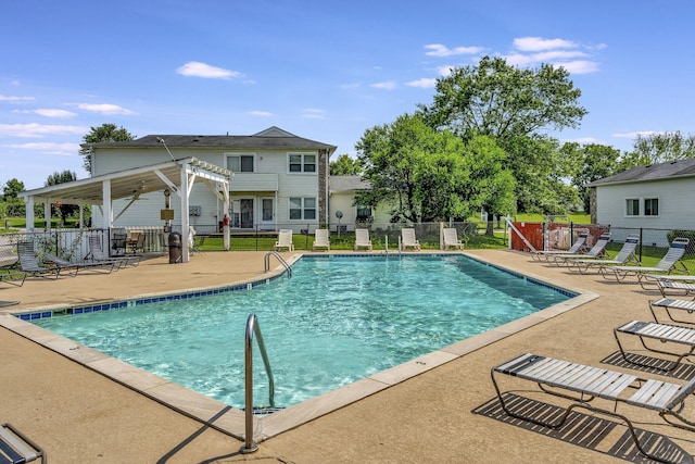 view of swimming pool featuring a pergola and a patio