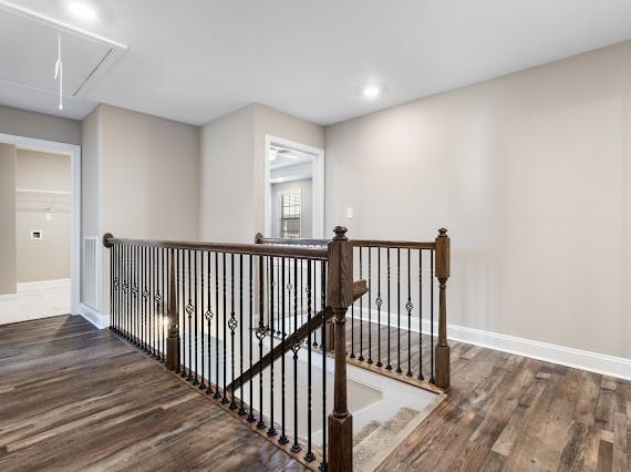 hallway with dark wood-type flooring