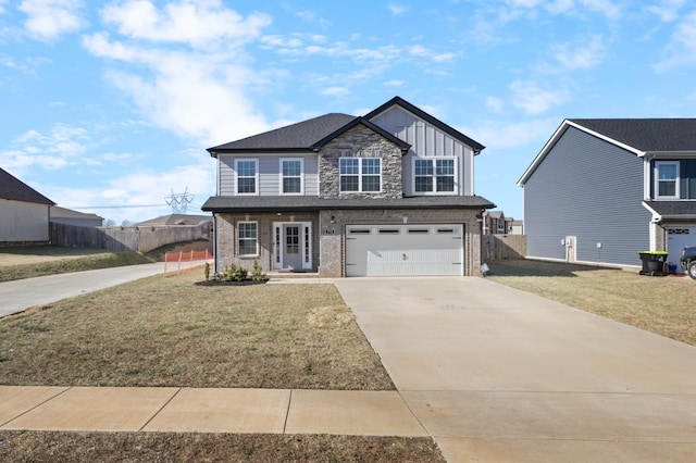 view of front of house with a garage and a front yard