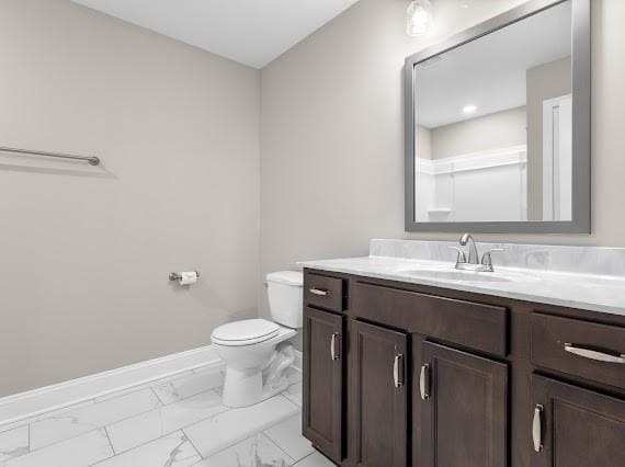 bathroom with vanity and toilet