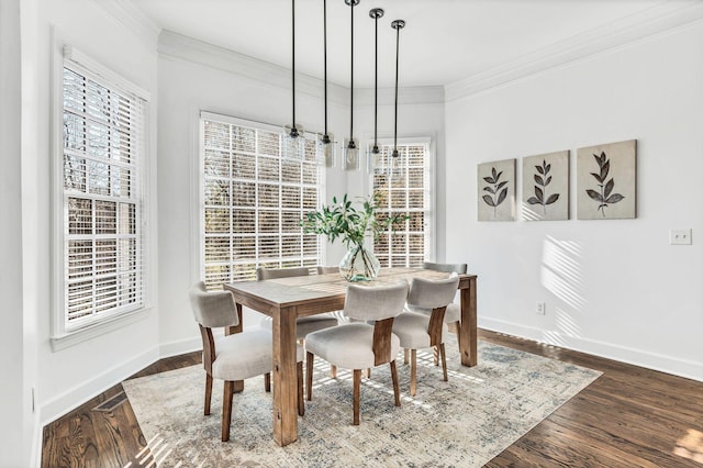 dining space with ornamental molding, a wealth of natural light, and dark wood-type flooring