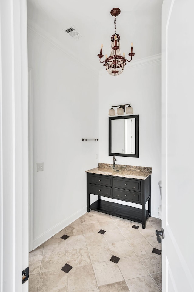 bathroom featuring toilet, vanity, crown molding, and a notable chandelier