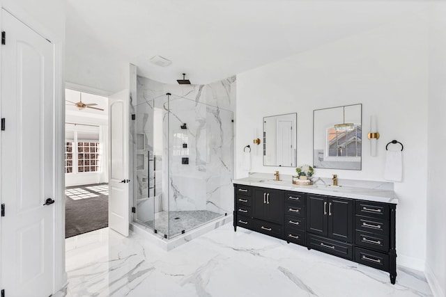 bathroom with vanity, ceiling fan, and a shower with shower door