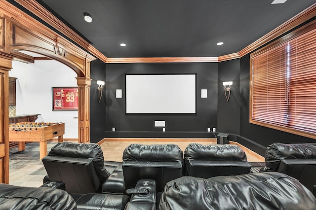 home theater featuring ornate columns and crown molding