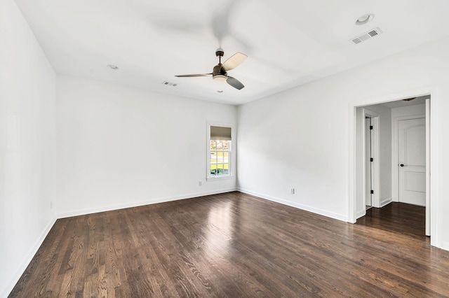 unfurnished room with dark hardwood / wood-style floors and ceiling fan