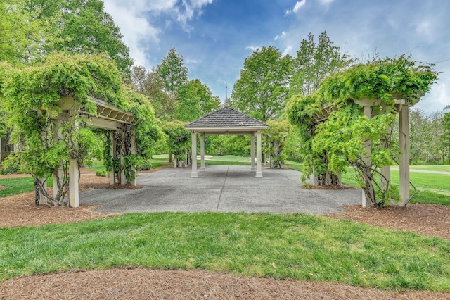 surrounding community featuring a gazebo and a yard