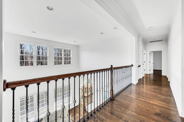 corridor featuring dark hardwood / wood-style flooring and ornamental molding