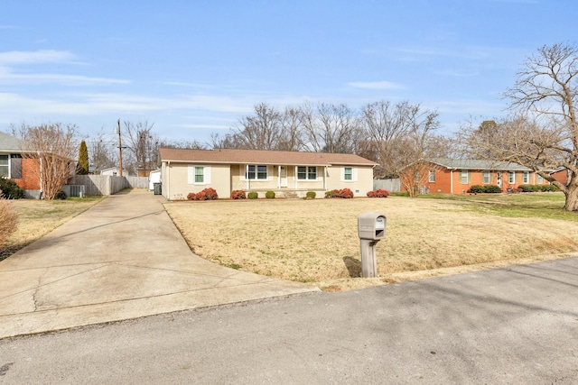 single story home with a front lawn