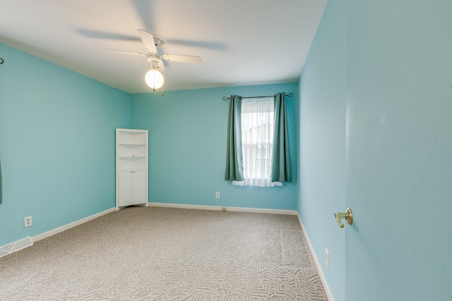 unfurnished bedroom with light colored carpet and ceiling fan