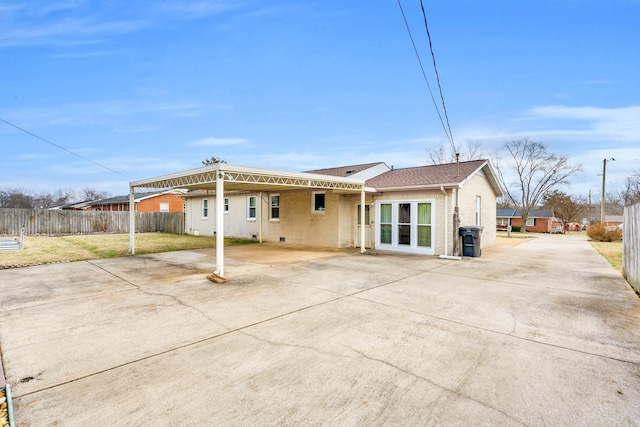 back of house with a patio area and a yard