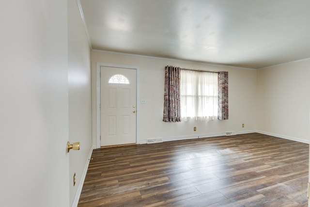 entryway with ornamental molding and dark wood-type flooring