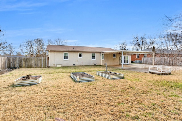 rear view of house with a patio area and a lawn