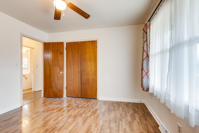 unfurnished bedroom with light hardwood / wood-style flooring and ceiling fan