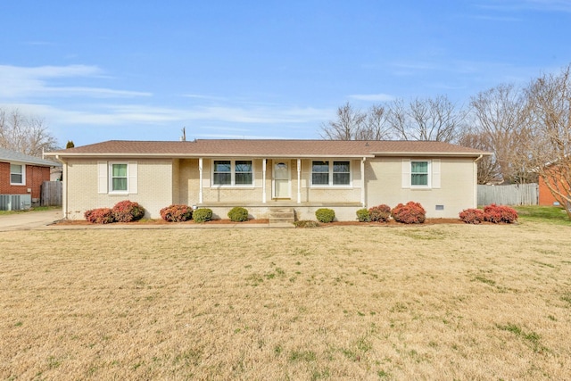 ranch-style house featuring a front yard and central AC