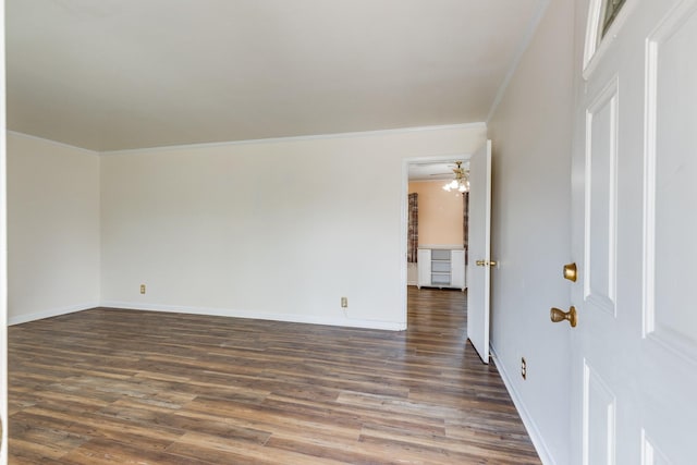 unfurnished room with crown molding, dark hardwood / wood-style flooring, and ceiling fan