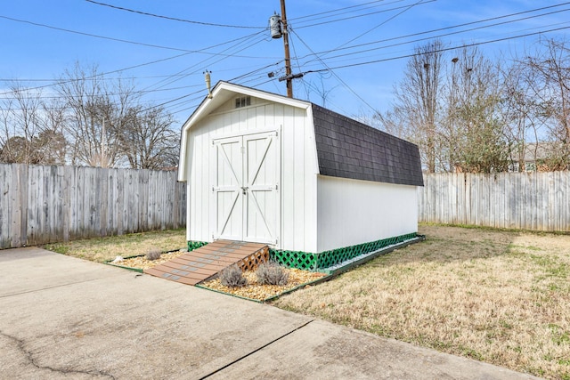 view of outdoor structure with a lawn