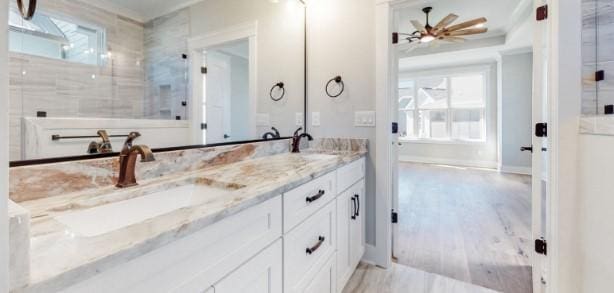 bathroom with vanity, ceiling fan, and wood-type flooring