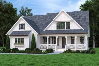 modern inspired farmhouse with a porch and a front yard