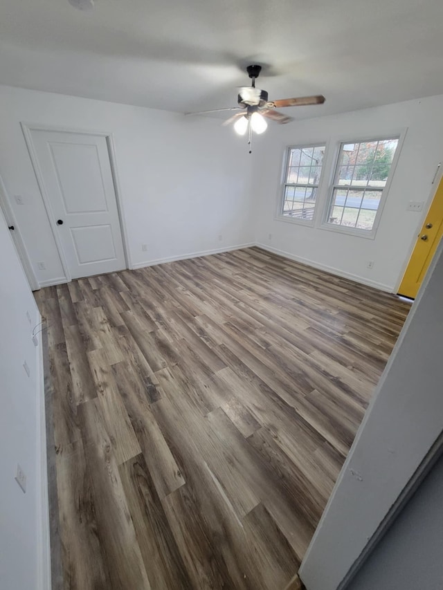 unfurnished room featuring hardwood / wood-style flooring and ceiling fan