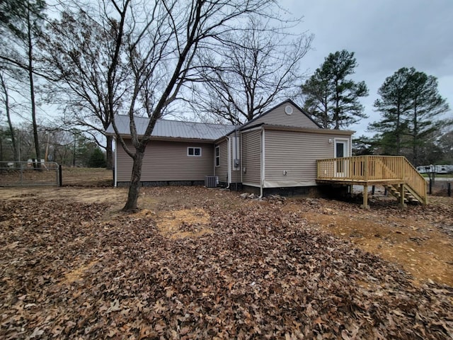 rear view of house with a wooden deck